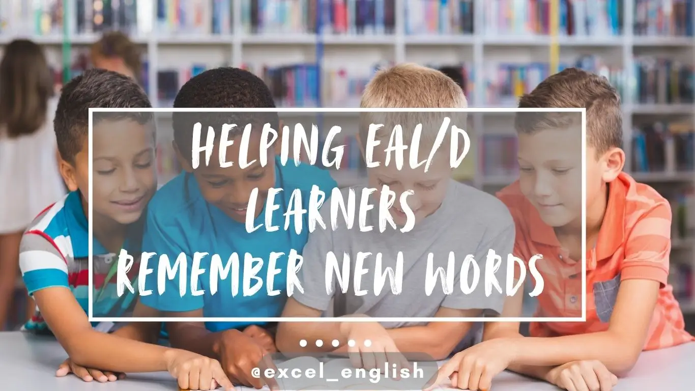 Primary ESL students of different backgrounds sitting around a table reading an English picture book together.
